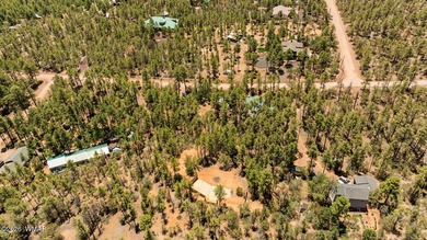 Tucked into two wooded acres of towering ponderosa pine, this is - photo 3