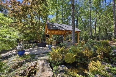 Tucked away on a quiet cul-de-sac in the gated community of the - photo 36