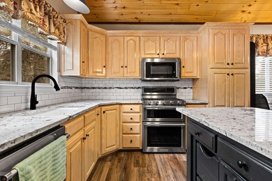 Perched on a scenic hilltop overlooking one of the Twin Lakes - photo 3