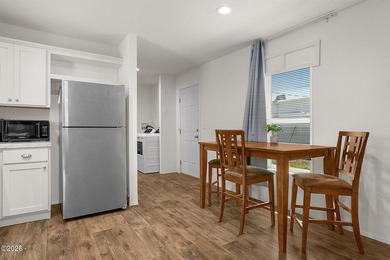 This 2021 manufactured home offers an inviting open floor plan - photo 7