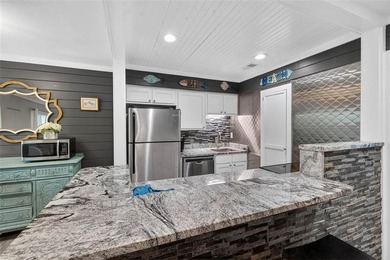 Nestled beneath a canopy of live oaks in the heart of St. Simons - photo 8