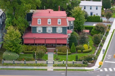 The historic Thomas Webster House, built in 1876, prominently - photo 1