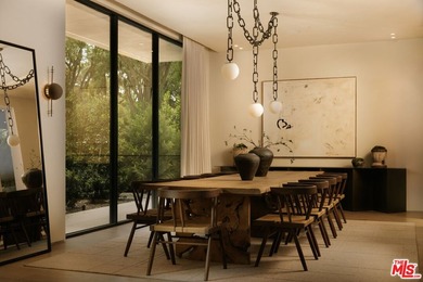 A dual-entry motor court paved in stone sets the stage for - photo 4