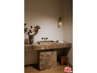 A dual-entry motor court paved in stone sets the stage for - photo 5