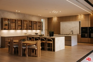 A dual-entry motor court paved in stone sets the stage for - photo 7