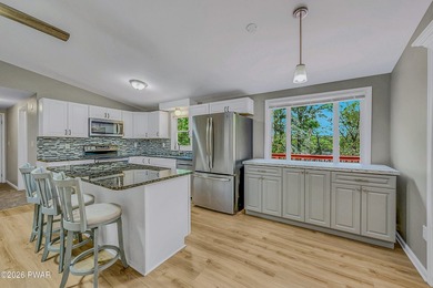 Nestled on a private second-tier lake lot, this charming ranch - photo 5