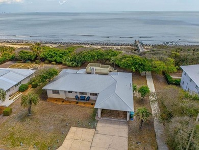 Experience the ultimate in coastal iving with this exceptional - photo 1