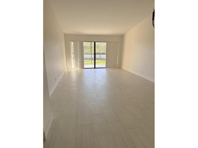 UPDATED 2ND FLOOR CONDO FEATURING WHITE EAT-IN KITCHEN WITH NEW - photo 2