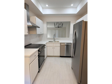 UPDATED 2ND FLOOR CONDO FEATURING WHITE EAT-IN KITCHEN WITH NEW - photo 3
