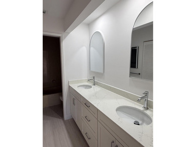 UPDATED 2ND FLOOR CONDO FEATURING WHITE EAT-IN KITCHEN WITH NEW - photo 9