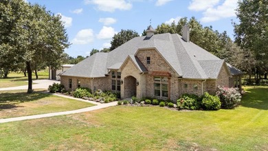 This fully custom, full-brick home sits on just under an acre in - photo 1