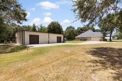 This fully custom, full-brick home sits on just under an acre in - photo 2
