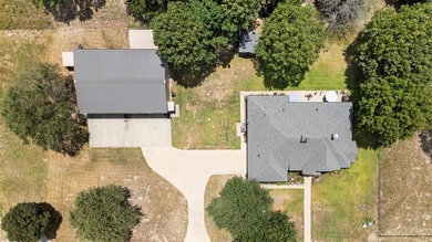 This fully custom, full-brick home sits on just under an acre in - photo 3