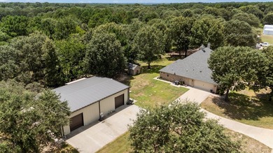 This fully custom, full-brick home sits on just under an acre in - photo 4