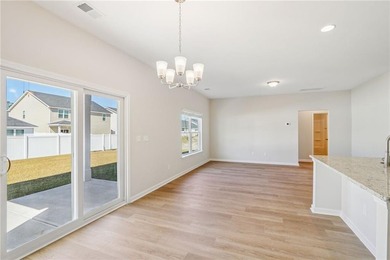 The Magnolia plan by Smith Family Homes is under construction in - photo 7