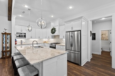 This fully custom, full-brick home sits on just under an acre in - photo 8
