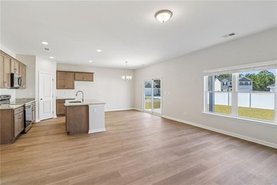 The Magnolia plan by Smith Family Homes is under construction in - photo 10