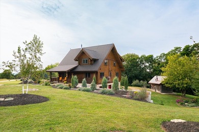 This custom log home was professionally designed and built in - photo 2