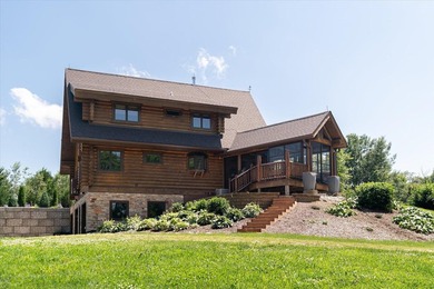 This custom log home was professionally designed and built in - photo 3