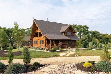 This custom log home was professionally designed and built in - photo 4