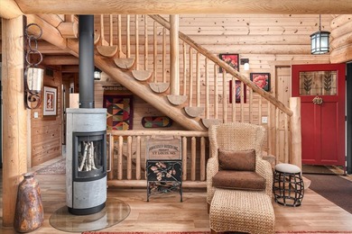 This custom log home was professionally designed and built in - photo 6