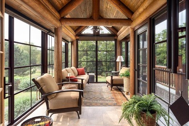 This custom log home was professionally designed and built in - photo 10