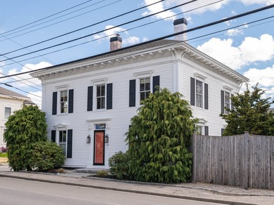 This beautiful 3,238 square foot c. 1832 Italianate sits in the - photo 1