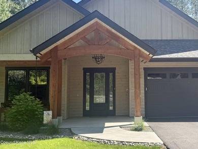 Nestled among mature trees in a private waterside setting, this - photo 4