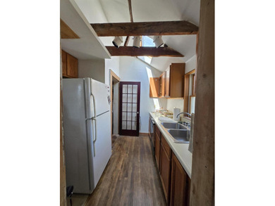 This unique cottage-style property in Falmouth, Maine, is a rare - photo 8