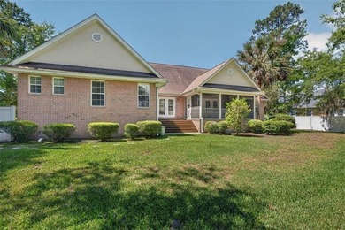 Welcome to Oak Grove Island, where this beautifully maintained - photo 3