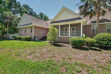 Welcome to Oak Grove Island, where this beautifully maintained - photo 4