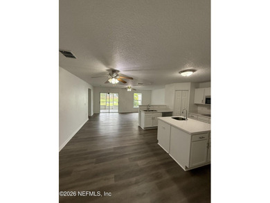 Welcome home to this beautifully remodeled home, sitting on a - photo 12
