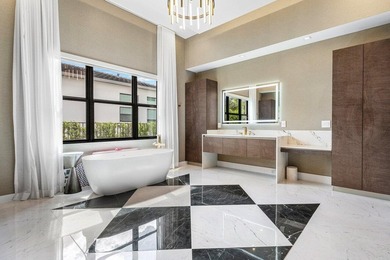 Located in the prestigious Boca Bridges community, this stunning - photo 21