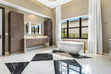 Located in the prestigious Boca Bridges community, this stunning - photo 22