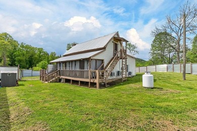 Nestled on nearly an acre, this charming three-bedroom - photo 4