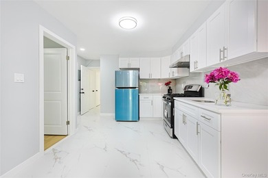 Welcome to this fully renovated 2-Family Condo Townhouse located - photo 12
