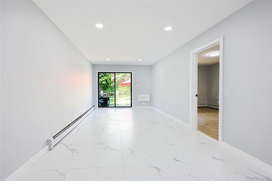 Welcome to this fully renovated 2-Family Condo Townhouse located - photo 13