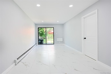 Welcome to this fully renovated 2-Family Condo Townhouse located - photo 14