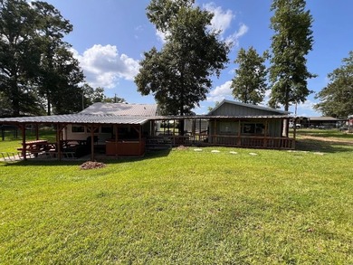 Two deeded waterfront lots on Lake Murvaul. Two homes. The - photo 1