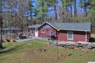 For those seeking a secluded cabin in the woods, this charming - photo 3