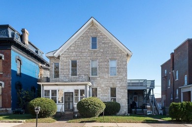 This nice Main street triplex could be your next investment - photo 1