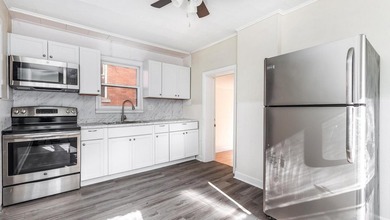 This nice Main street triplex could be your next investment - photo 5