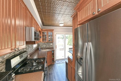 Welcome to this beautifully updated Cape Cod situated on a - photo 13