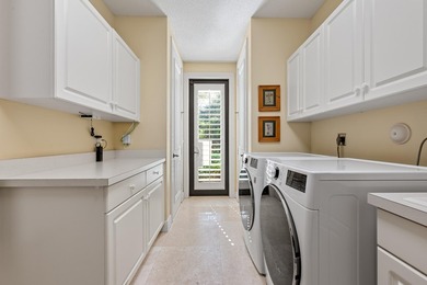 Nestled on a serene cul-de-sac within the prestigious gated - photo 33