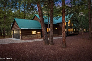 Experience mountain luxury and serene golf course living in this - photo 2