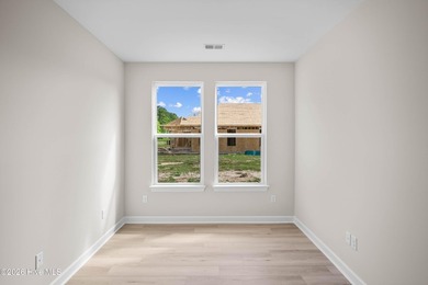 The Cherry Grove model offers a spacious and inviting retreat - photo 10