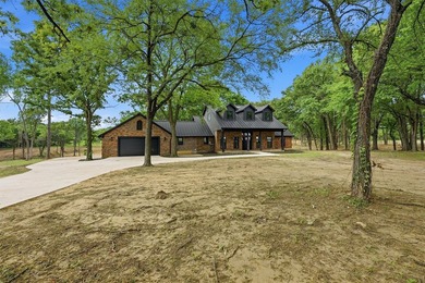 Set on 11 gently rolling acres in Sadler, TX, this beautifully - photo 2