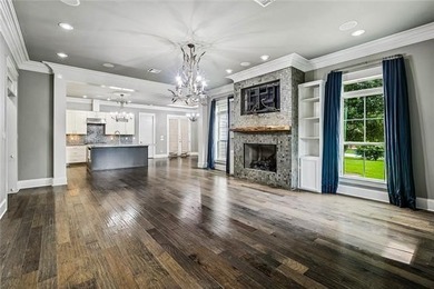 Charming Raised Cottage. Step inside to an open-concept living - photo 3