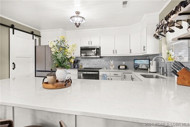 Discover this immaculate 2nd-tier ranch in Linn Creek, boasting - photo 15