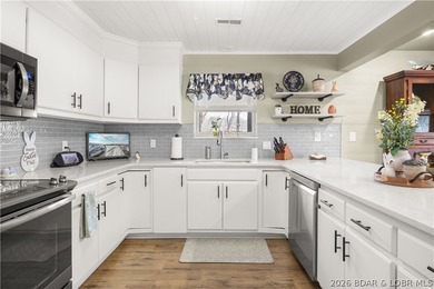 Discover this immaculate 2nd-tier ranch in Linn Creek, boasting - photo 17